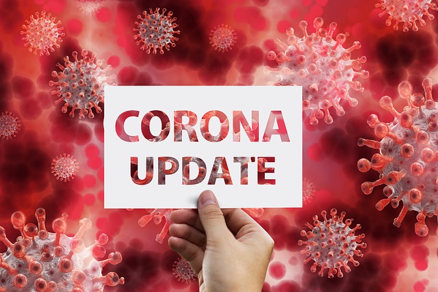 Corona update sign with the virus in the background